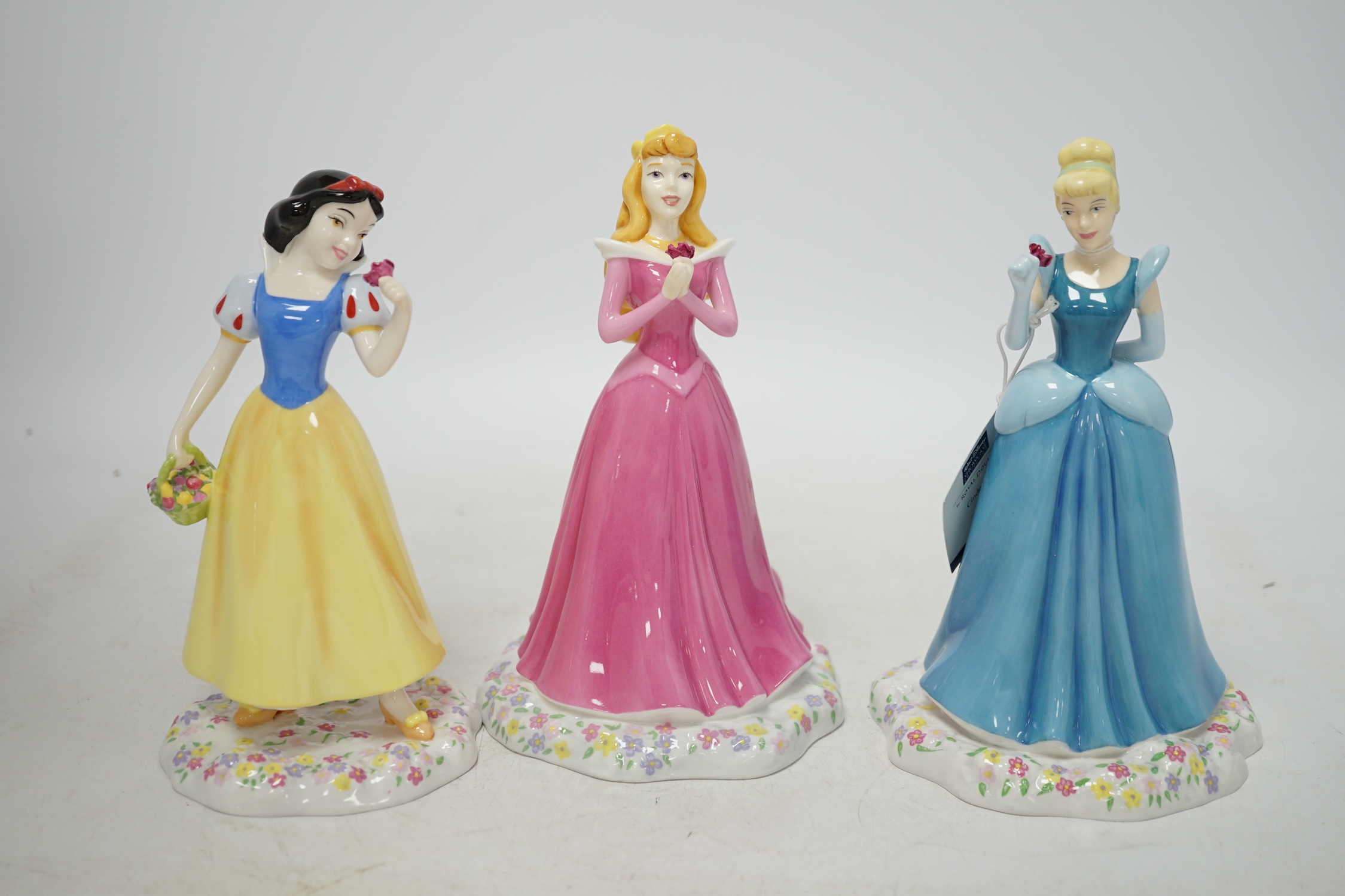 Three Royal Doulton Disney Showcase figures comprising, Cinderella, Sleeping Beauty and Snow White, with boxes and certificates, 19cm high. Condition - good